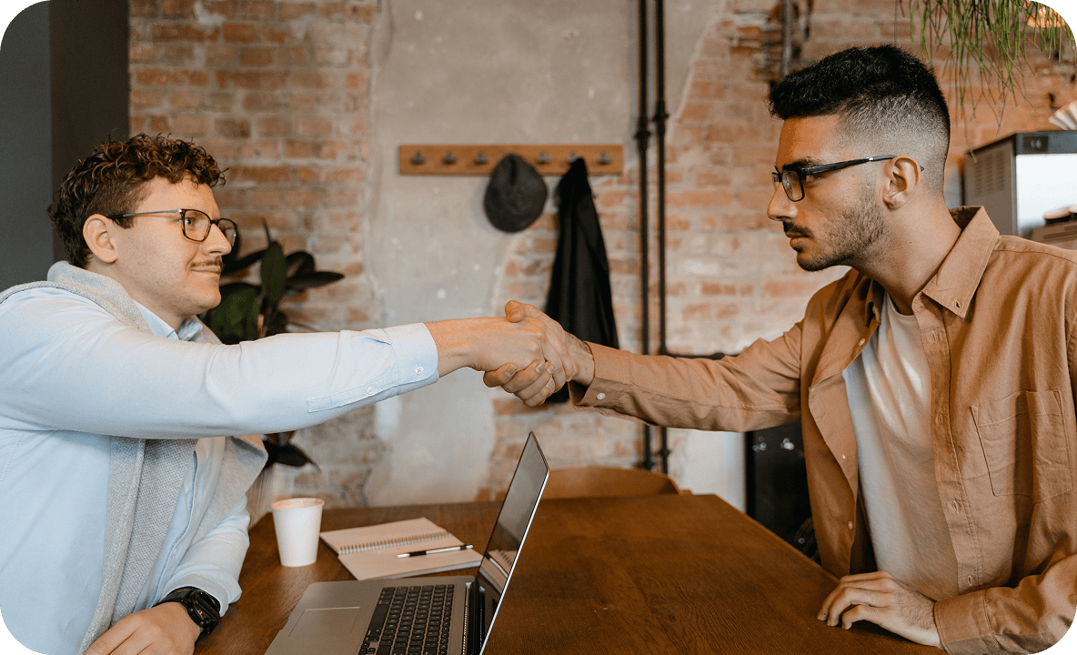 Two people shaking hands after a shift